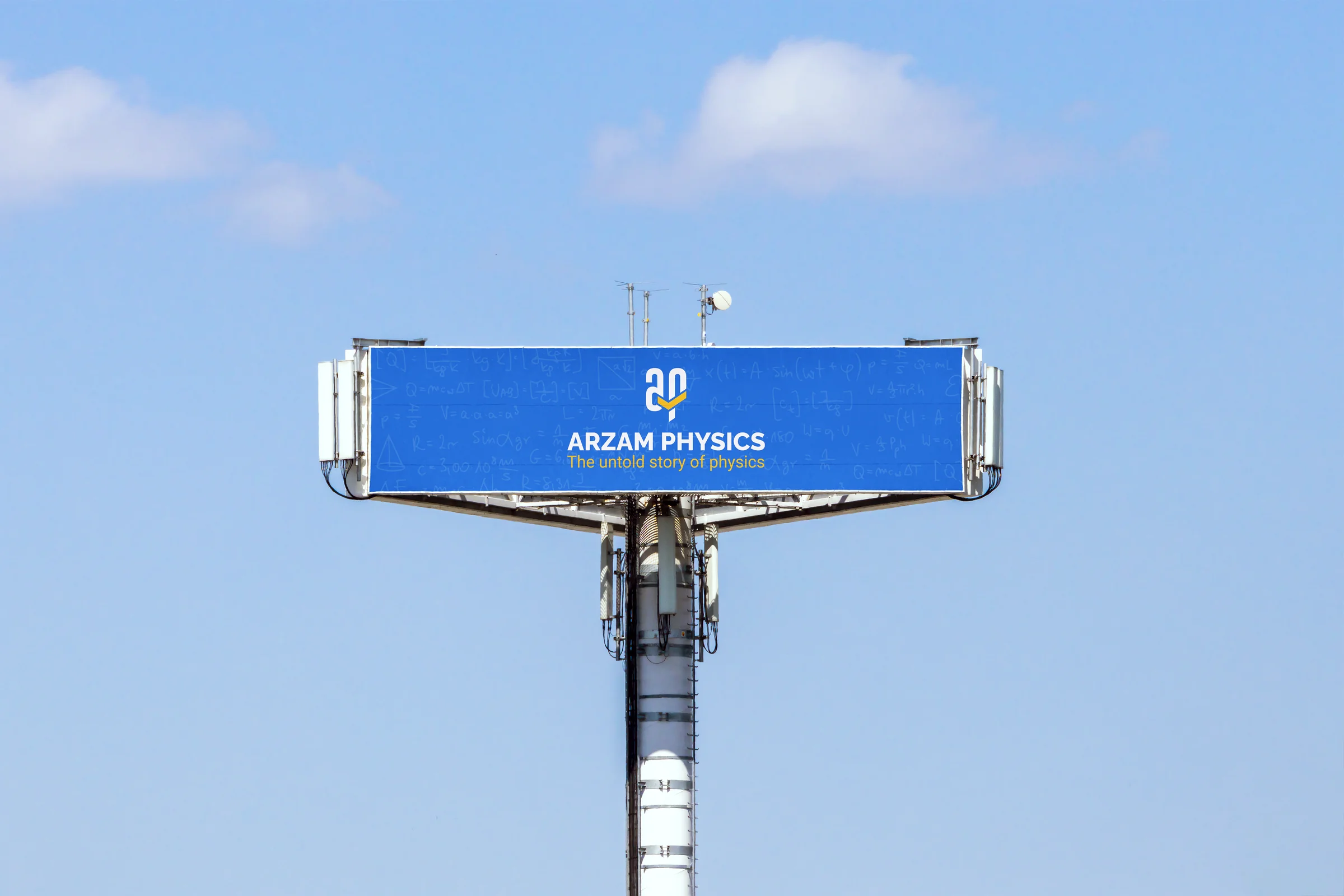 Large roadside billboard showing the Arzam Physics logo and tagline "the untold story of physics" set against a chalkboard of physics formulas