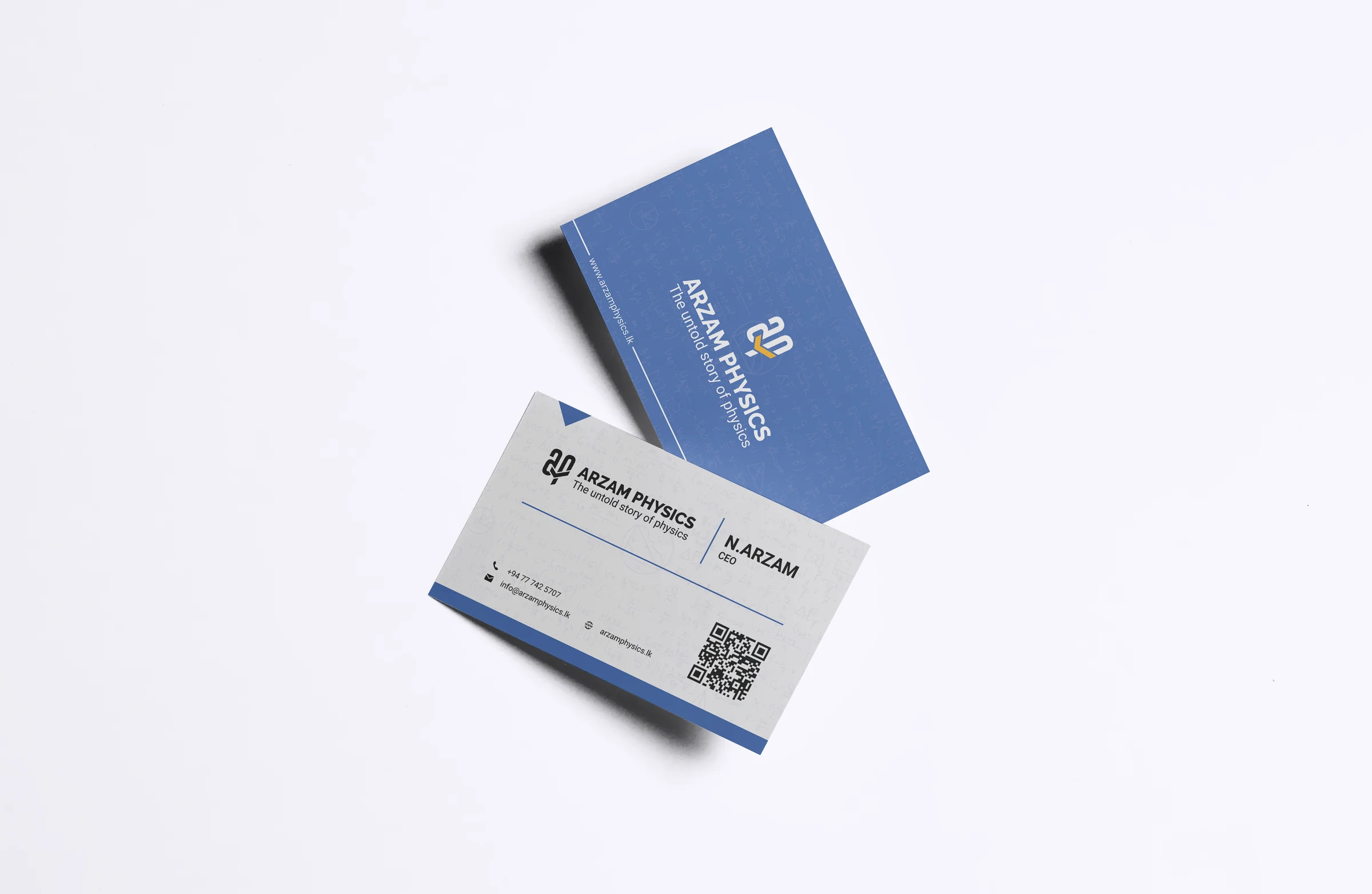 Two stacked business cards — a deep blue front with the Arzam Physics mark, and a white back carrying the founder's contact details