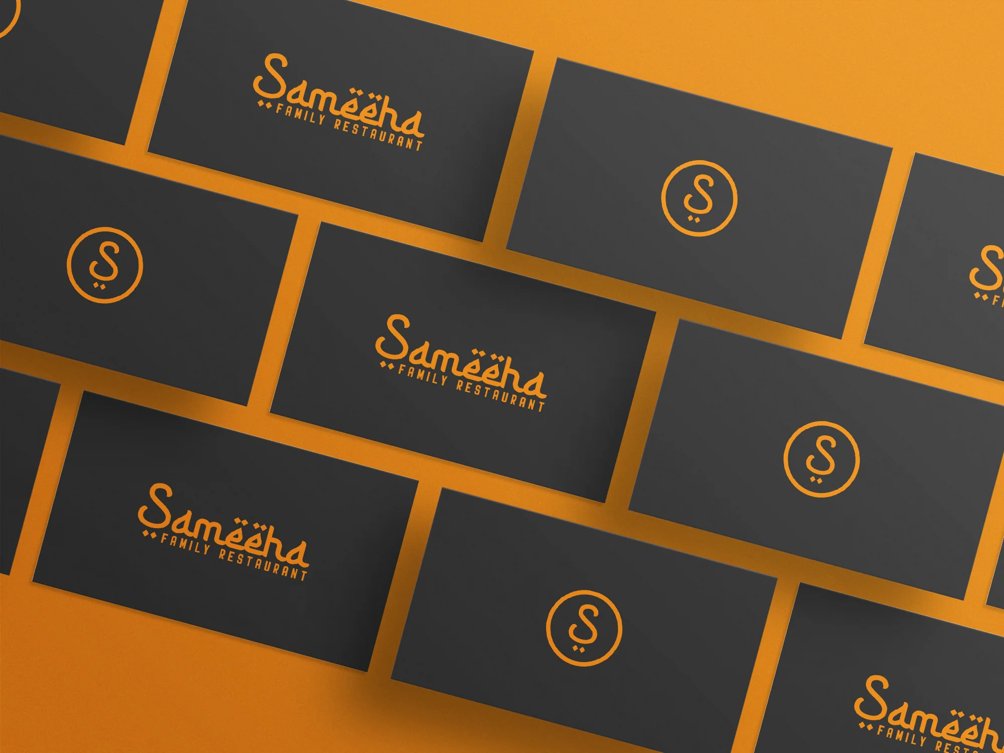 Sameeha Family Restaurant logo mockup — business cards laid out across an orange backdrop showing the wordmark and the "S" monogram